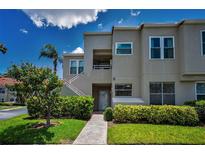 Inviting two-story condo featuring well-maintained landscaping and private entrance with stairs and neutral paint at 6080 Bahia Del Mar Cir # 109, St Petersburg, FL 33715