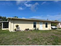 Charming single-story home with a well-maintained front yard and a covered parking area at 6383 Biscayne, North Port, FL 34287