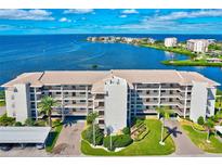 Beautiful waterfront condo complex with manicured landscaping, covered parking, and stunning water views at 8211 Brent St # 815, Port Richey, FL 34668