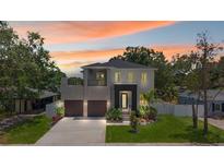 Stunning two-story home featuring manicured landscaping, two-car garage, and welcoming curb appeal at 4604 W Euclid Ave, Tampa, FL 33629