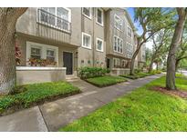 Charming townhouse features a private entrance, beautiful landscaping and classic architectural details at 507 S Willow Ave, Tampa, FL 33606