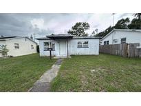 Modest single story home featuring a covered porch and small front yard at 2410 38Th N Ave, St Petersburg, FL 33713