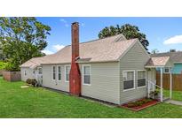 Charming single-Gathering home featuring neat landscaping and a classic brick chimney at 3327 25Th N St, St Petersburg, FL 33713