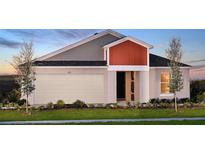 Charming single-Gathering home features a 2-car garage, manicured lawn, and a cozy covered entryway at 13028 Wellspring Dr, Lithia, FL 33547