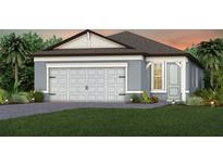 Charming single-story home with a two car garage and a well-manicured lawn with tropical foliage at 13733 Canyon Ridge Rd, Spring Hill, FL 34610