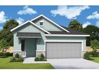 Charming single-story home featuring a two-car garage and tasteful stone accents at 31172 Pendleton Landing Cir, Wesley Chapel, FL 33545