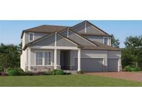 Charming two-story home with a three-car garage, beautiful stone accents, and a well-maintained lawn at 4765 Southern Valley Loop, Brooksville, FL 34601