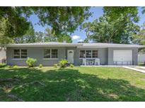 Charming single-story home with a well-maintained front yard and attached one car garage at 4917 99Th N St, St Petersburg, FL 33708