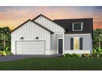 Charming single-Gathering home showcasing a modern farmhouse design with a two-car garage at 13660 Canyon Ridge Rd, Spring Hill, FL 34610