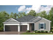 Charming single-story home with a two-car garage and welcoming front entrance and beautiful landscaping at 1633 Trailhead Ln, Zephyrhills, FL 33541
