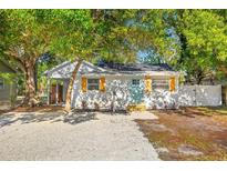 Charming single-story home with a gravel yard and light blue front door at 1752 42Nd S St, St Petersburg, FL 33711