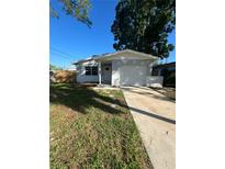 Charming single-story home with a well-maintained lawn and a convenient attached garage and front yard at 1782 Michigan Ne Ave, St Petersburg, FL 33703