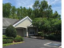 Charming home featuring an attached garage and well-maintained landscaping at 3493 Kings Rd # 106, Palm Harbor, FL 34685