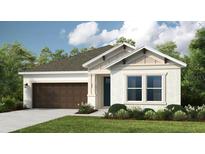 Inviting single-Gathering home featuring a two-car garage, manicured lawn, and neutral color scheme at 33618 Castaway Loop, Wesley Chapel, FL 33543