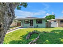 Charming single-story home with well-maintained lawn and inviting curb appeal at 5001 37Th N Ave, St Petersburg, FL 33710