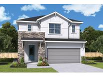 Charming two-story home with stone accents, landscaped yard, and a two-car garage at 640 Allora Ave, Nokomis, FL 34275