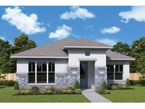 Charming single-story home featuring stone accents, well-manicured lawn, and inviting front entrance at 699 Allora Ave, Nokomis, FL 34275