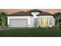 Charming single-Gathering home with a two-car garage, lovely landscaping, and a well-manicured lawn at 13690 Canyone Ridge Rd, Spring Hill, FL 34610
