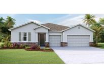 Charming single-story home with a two-car garage and stone accents at 2236 Sienna Spruce St, Wesley Chapel, FL 33543