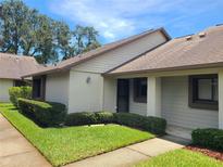 Charming home exterior with landscaped front yard and inviting entryway at 2588 Laurelwood Dr # 16A, Clearwater, FL 33763
