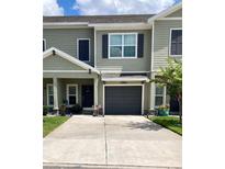 Charming townhome with a one-car garage and well-maintained landscaping at 10824 Quickwater Ct, Riverview, FL 33569
