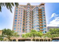 A stunning high-rise condo building with a light tan color and teal window trim is accented by curved balconies at 288 Beach Ne Dr # 12C, St Petersburg, FL 33701