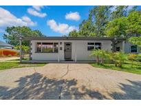 Charming single-story home featuring a covered entryway and a spacious driveway at 762 77Th N Ave, St Petersburg, FL 33702