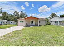 Charming single-story home with a well-maintained front yard and inviting curb appeal under a sunny sky at 9413 Forest Hills Dr, Tampa, FL 33612