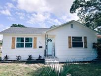 Charming single-story home featuring a new roof, fresh exterior paint, decorative shutters and landscaped yard at 811 40Th S Ave, St Petersburg, FL 33705