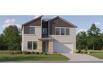 Two-story home featuring a two-car garage, neutral stucco, dark brown accents, and a covered front entryway at 9360 Gladsome Dr, Land O Lakes, FL 34637
