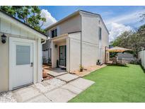 Charming two-story home featuring a cozy backyard and a welcoming front entrance at 103 E Davis Blvd # B, Tampa, FL 33606