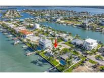 Waterfront home with a pool, private dock, and scenic views of the bay at 11240 6Th E St, Treasure Island, FL 33706