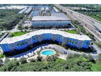 Scenic aerial view of a condo with a pool, close to the marina and highway at 3315 58Th S Ave # 115, St Petersburg, FL 33712
