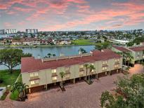 Waterfront townhouse offers picturesque coastal living with views of the harbor and vibrant sunsets at 459 Haven Point Dr, Treasure Island, FL 33706