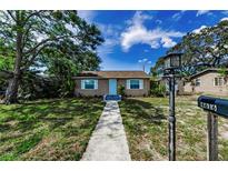 Charming single-story home with well-maintained lawn and inviting walkway leading to the front door at 4616 5Th N Ave, St Petersburg, FL 33713
