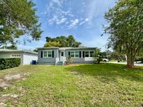 Charming single-story home with a well-maintained lawn, fresh exterior paint, and inviting curb appeal at 1554 Elmwood St, Clearwater, FL 33755
