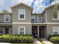 Charming two-story townhouse with well-maintained landscaping and a welcoming entrance at 2349 Willimette Dr, Wesley Chapel, FL 33543