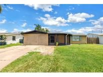 Charming single-story home with well-maintained lawn and decorative stone facade at 3743 Cherrywood Dr, Holiday, FL 34691