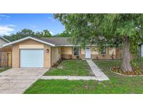 Charming single-story home featuring a one-car garage, well-kept lawn, and appealing curb appeal at 6511 3Rd Ne Ave, Bradenton, FL 34208