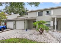 Charming townhome featuring a well-maintained front yard and inviting entryway at 1724 Adams S Cir, Largo, FL 33771