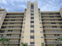 Stunning exterior view of the condo building with multiple stories and beautiful balcony views at 2621 Cove Cay Dr # 206, Clearwater, FL 33760