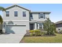Charming two-story home with a well-maintained lawn and a two car garage at 4515 Bent Tree Blvd, Sarasota, FL 34241