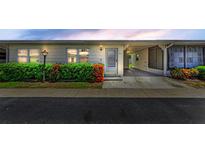 Charming home featuring a covered carport, well-maintained landscaping, and a welcoming entrance at 12400 Park Blvd # 311, Seminole, FL 33772