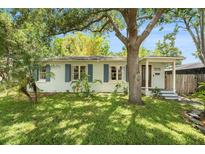 Charming single-story home with a lush front lawn and mature trees offering ample shade at 3709 W San Pedro St, Tampa, FL 33629