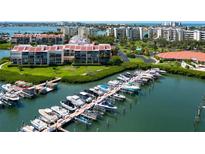 Close aerial view of the community boat dock and marina, showcasing boat storage and convenient waterfront living at 7907 Sailboat Key S Blvd # 108, South Pasadena, FL 33707