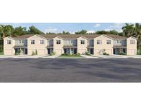 Charming townhome exterior with a manicured lawn and attached garage, perfect for modern living at 31262 Midnight Sun Way, Wesley Chapel, FL 33545