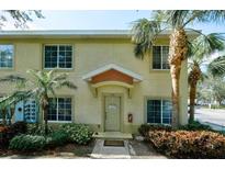Charming townhouse with front door, well maintained landscaping and tropical palm trees at 3909 45Th W Ter # 102, Bradenton, FL 34210