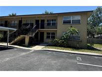 Exterior view of two-story building with parking at 2501 Harn Blvd # H20, Clearwater, FL 33764