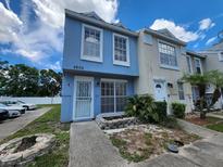 Charming two-story townhome with a well-kept lawn and inviting entrance at 6620 121St Ave # 1, Largo, FL 33773