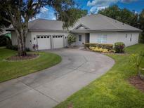 Charming single-story home with a spacious driveway and a well-manicured lawn at 1137 Pristine Pl, Lutz, FL 33549